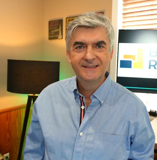 Paul, founder of BuiltOnRealEstate, in his office